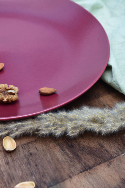solid maroon ceramic dinner plate